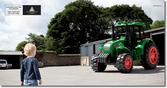 image of child with giant toy tractor